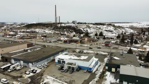 Aerial photo of the existing Webbwood building among industrial lots, with the Sudbury Superstack on the horizon