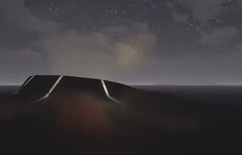 The same building at night under a starry sky