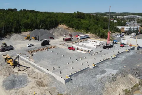 Aerial photo of foundations and footings on the levelled site during construction
